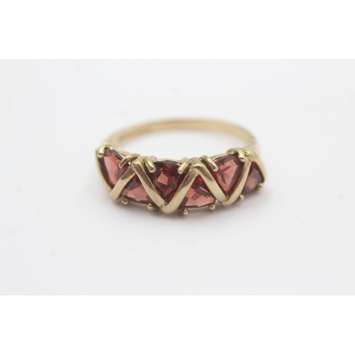 29 - 9ct gold garnet five stone dress ring (3.2g) Size R 1/2