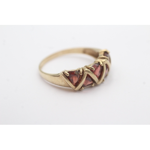 29 - 9ct gold garnet five stone dress ring (3.2g) Size R 1/2