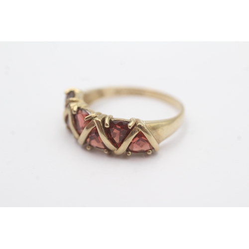 29 - 9ct gold garnet five stone dress ring (3.2g) Size R 1/2