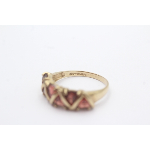 29 - 9ct gold garnet five stone dress ring (3.2g) Size R 1/2