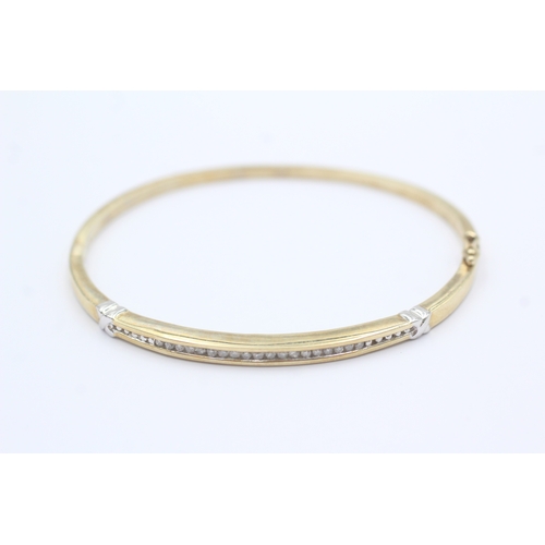 36 - 9ct gold diamond bangle (10.1g)