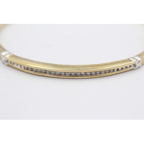 36 - 9ct gold diamond bangle (10.1g)