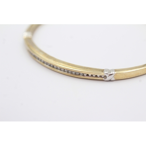 36 - 9ct gold diamond bangle (10.1g)