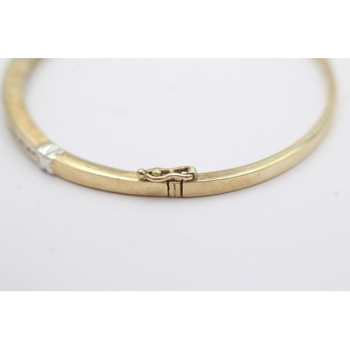 36 - 9ct gold diamond bangle (10.1g)