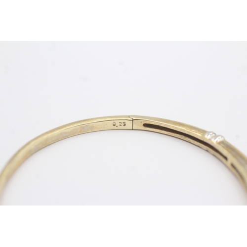 36 - 9ct gold diamond bangle (10.1g)