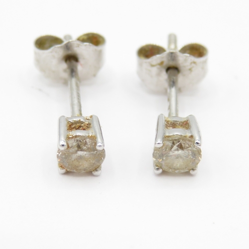 27 - 14ct white gold diamond studs earrings (0.7g)