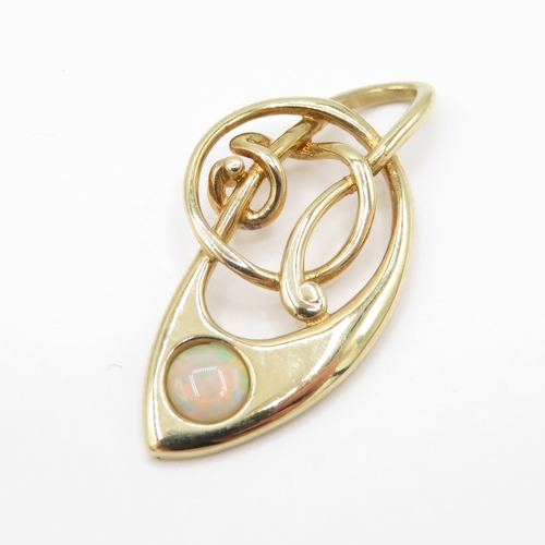 58 - 9ct gold opal music note pendant (1.5g)
