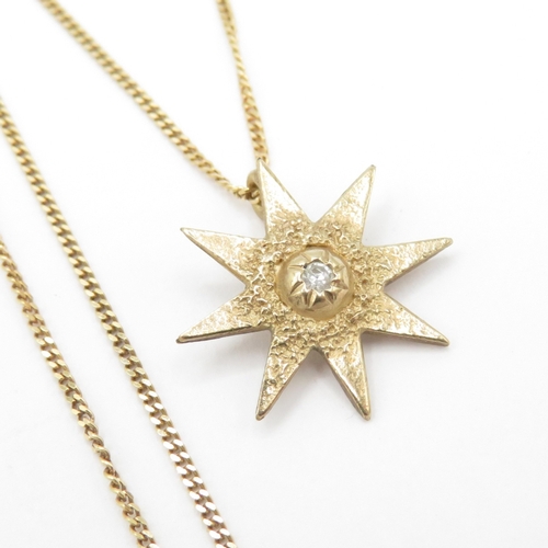 60 - 9ct gold diamond starburst pendant necklace (1.4g)