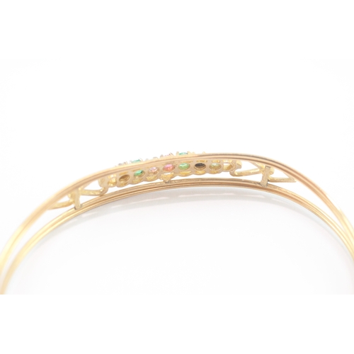 24 - 9ct gold acrostic 'DEAREST' bangle, including diamond emerald ruby sapphire (5g)
