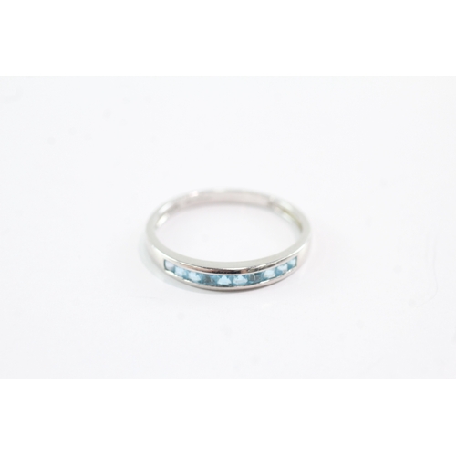 30 - 9ct gold blue topaz half eternity ring (2g) Size V