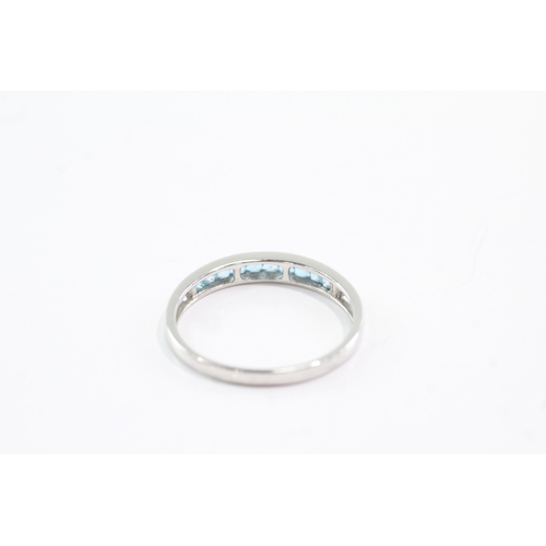 30 - 9ct gold blue topaz half eternity ring (2g) Size V