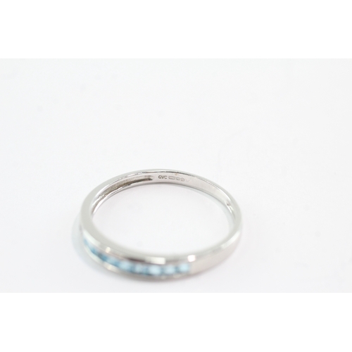 30 - 9ct gold blue topaz half eternity ring (2g) Size V