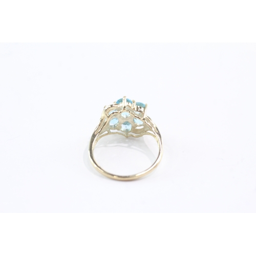 34 - 9ct gold topaz cluster ring (2.6g) Size M