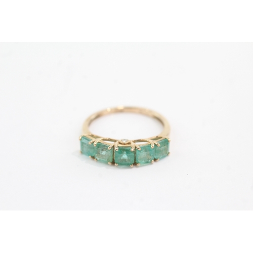 44 - 9ct gold emerald five stone ring with diamond on the side (1.9g) Size N