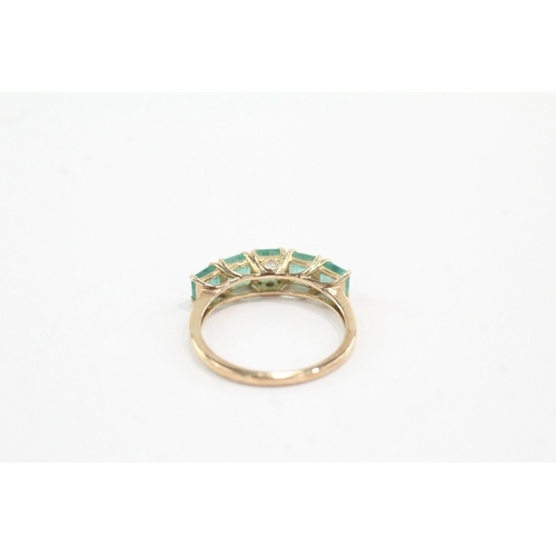 44 - 9ct gold emerald five stone ring with diamond on the side (1.9g) Size N