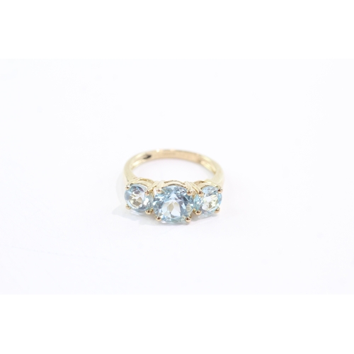 50 - 9ct gold topaz three stone ring (3.4g) Size N