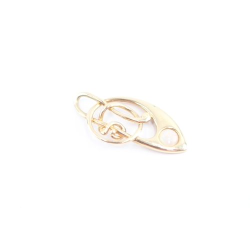 58 - 9ct gold opal music note pendant (1.5g)