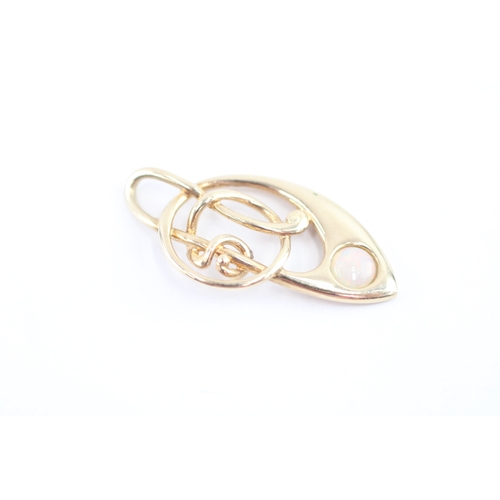 58 - 9ct gold opal music note pendant (1.5g)
