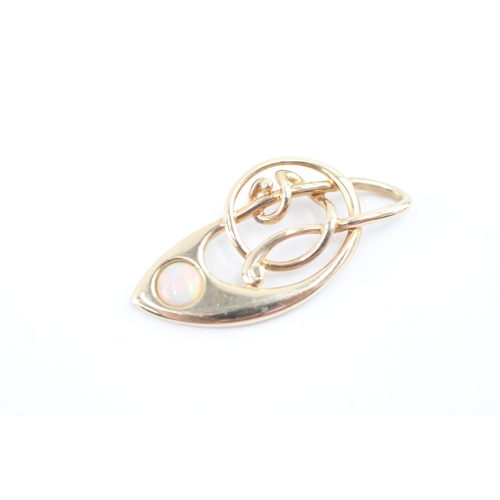 58 - 9ct gold opal music note pendant (1.5g)