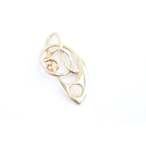 58 - 9ct gold opal music note pendant (1.5g)