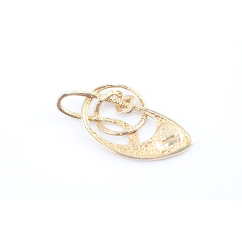 58 - 9ct gold opal music note pendant (1.5g)