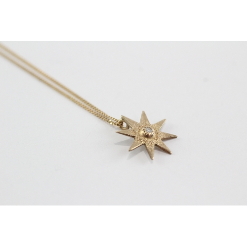 60 - 9ct gold diamond starburst pendant necklace (1.4g)