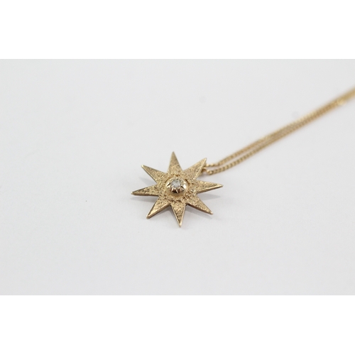 60 - 9ct gold diamond starburst pendant necklace (1.4g)