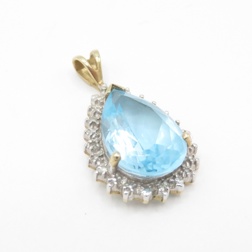 25 - 9ct gold blue topaz pear cut diamond halo cluster pendant (2.4g)