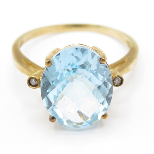 28 - 9ct gold blue topaz diamond dress ring (2.9g) Size Q