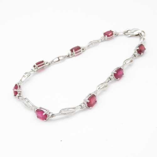32 - 14ct white gold ruby diamond link bracelet (5.8g)