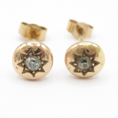 54 - 9ct gold diamond gypsy studs (1.6g)