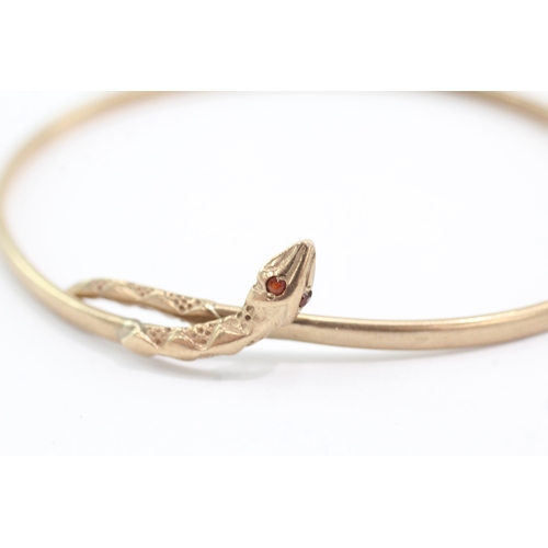 11 - 9ct gold ruby eyes snake bangle (5g)