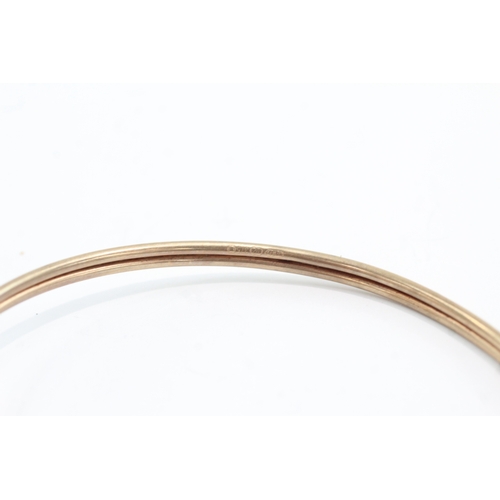 11 - 9ct gold ruby eyes snake bangle (5g)