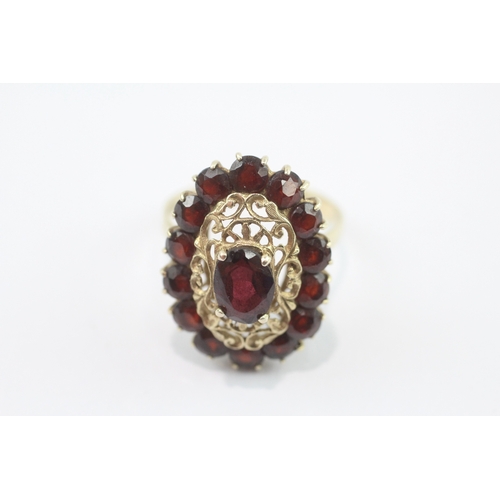 22 - 9ct gold garnet openwork cocktail ring (4.1g) Size O