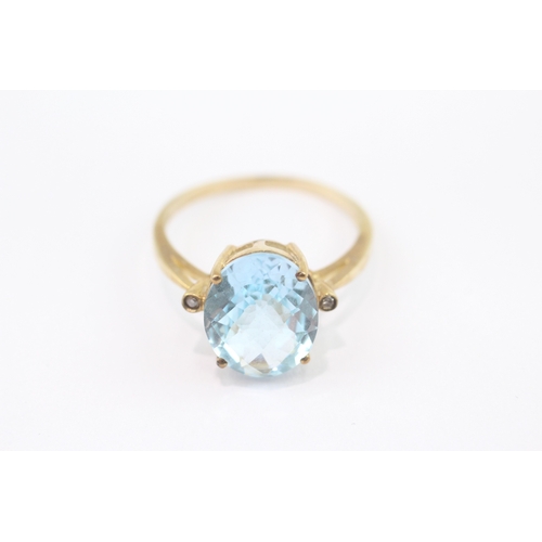 28 - 9ct gold blue topaz diamond dress ring (2.9g) Size Q