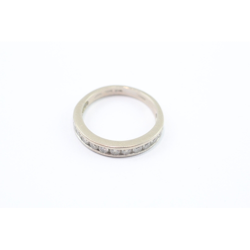 39 - 18ct white gold diamond half eternity channel set ring (2.7g) Size J