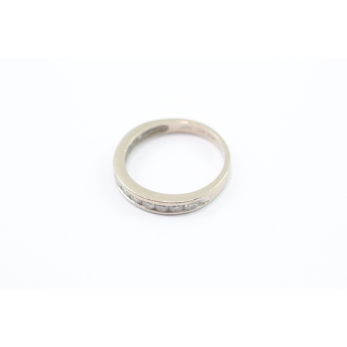 39 - 18ct white gold diamond half eternity channel set ring (2.7g) Size J