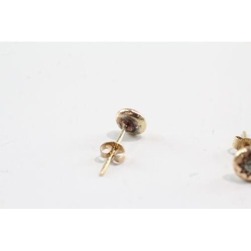 54 - 9ct gold diamond gypsy studs (1.6g)