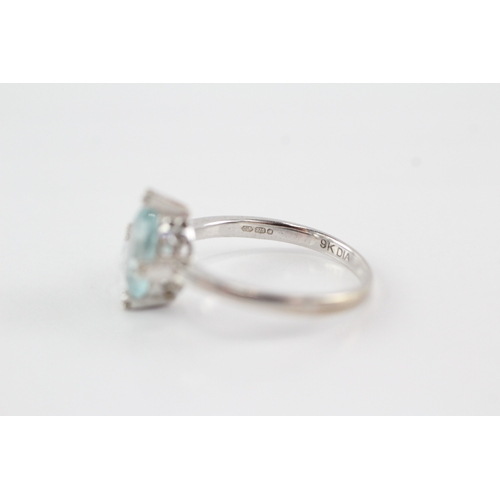 55 - 9ct gold topaz diamond ring (2.7g) Size O
