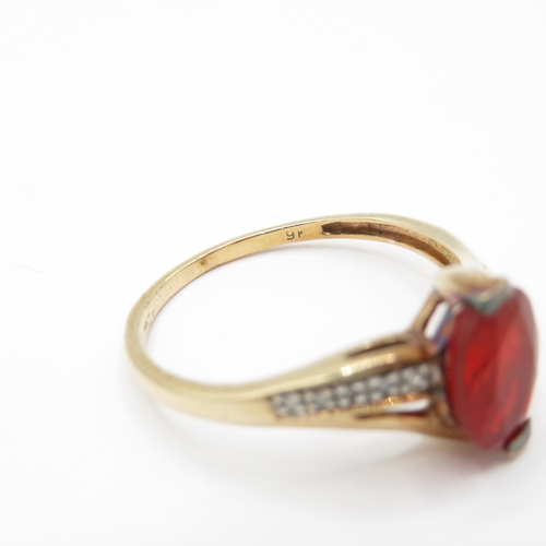 12 - 9ct Gold Garnet and Diamond Twist Ring (2.4g) Size R