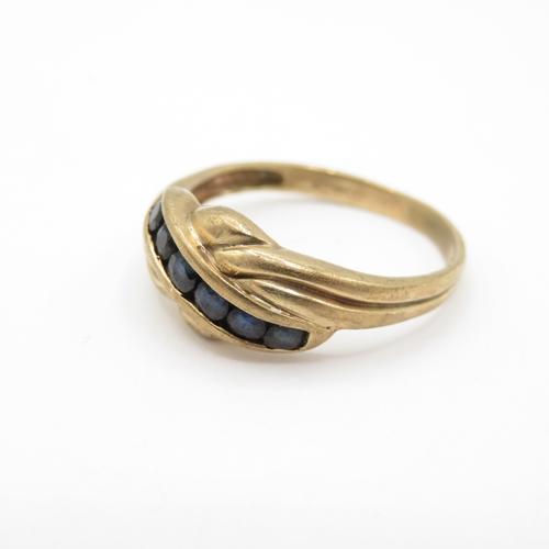 57 - 9ct Gold Sapphire Channel Set Twist Ring (2.5g) Size P