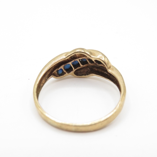57 - 9ct Gold Sapphire Channel Set Twist Ring (2.5g) Size P