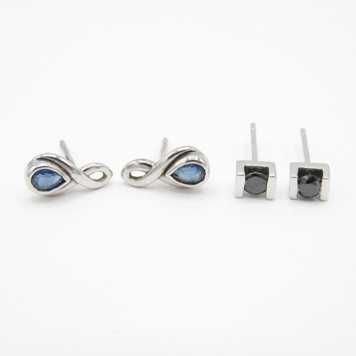 24 - 2 x 9ct White Gold Black Diamond & Sapphire Stud Earrings (1.8g)