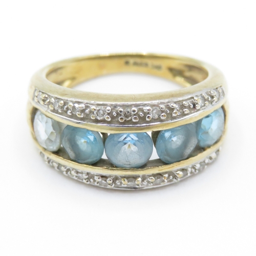 21 - 9ct gold blue topaz & diamond dress ring (2.8g) Size I