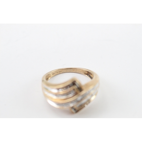 45 - 9ct gold diamond crossover ring (4.2g) Size N
