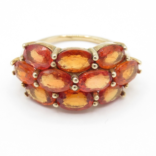 48 - 9ct gold colour enhanced orange sapphire ring (3.5g) Size K