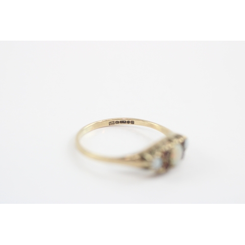 11 - 9ct gold opal garnet boat ring (1.3g) Size N
