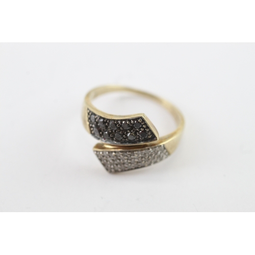 15 - 9ct gold black gem and diamond bypass ring (3.6g) Size P 1/2