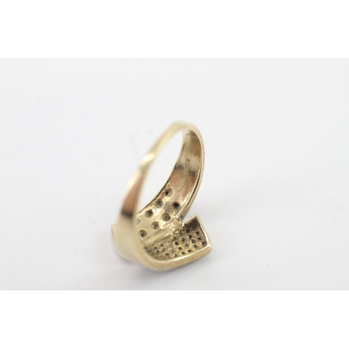 15 - 9ct gold black gem and diamond bypass ring (3.6g) Size P 1/2