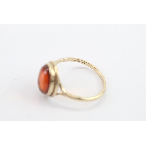 34 - 9ct gold amber cabochon solitaire ring (1.5g) Size L 1/2